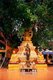 Thailand: Buddha statue under a bodhi tree in the grounds of 15th century Wat Jet Yot, Chiang Mai, northern Thailand